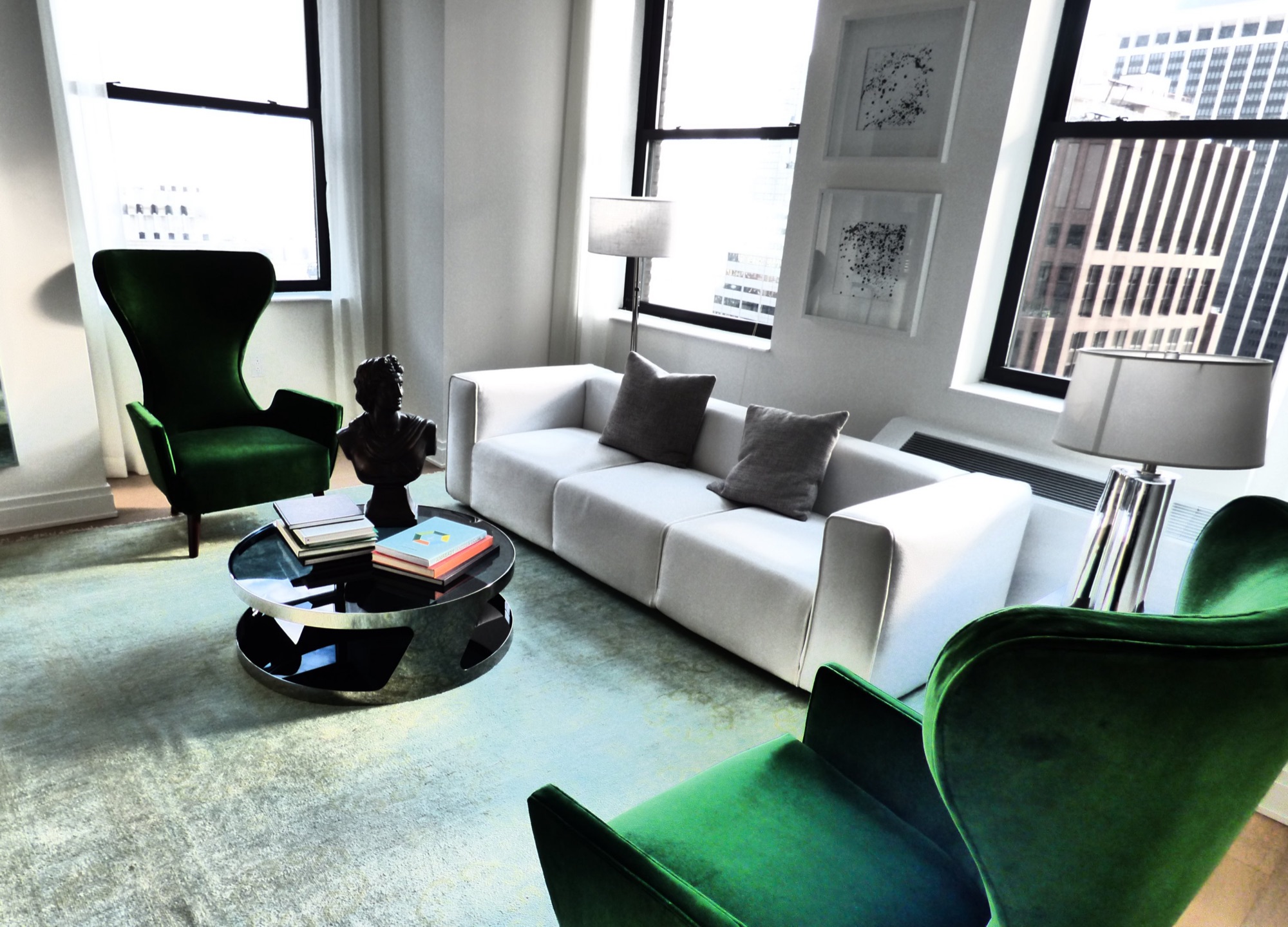 A Manhattan apartment living room with tall windows